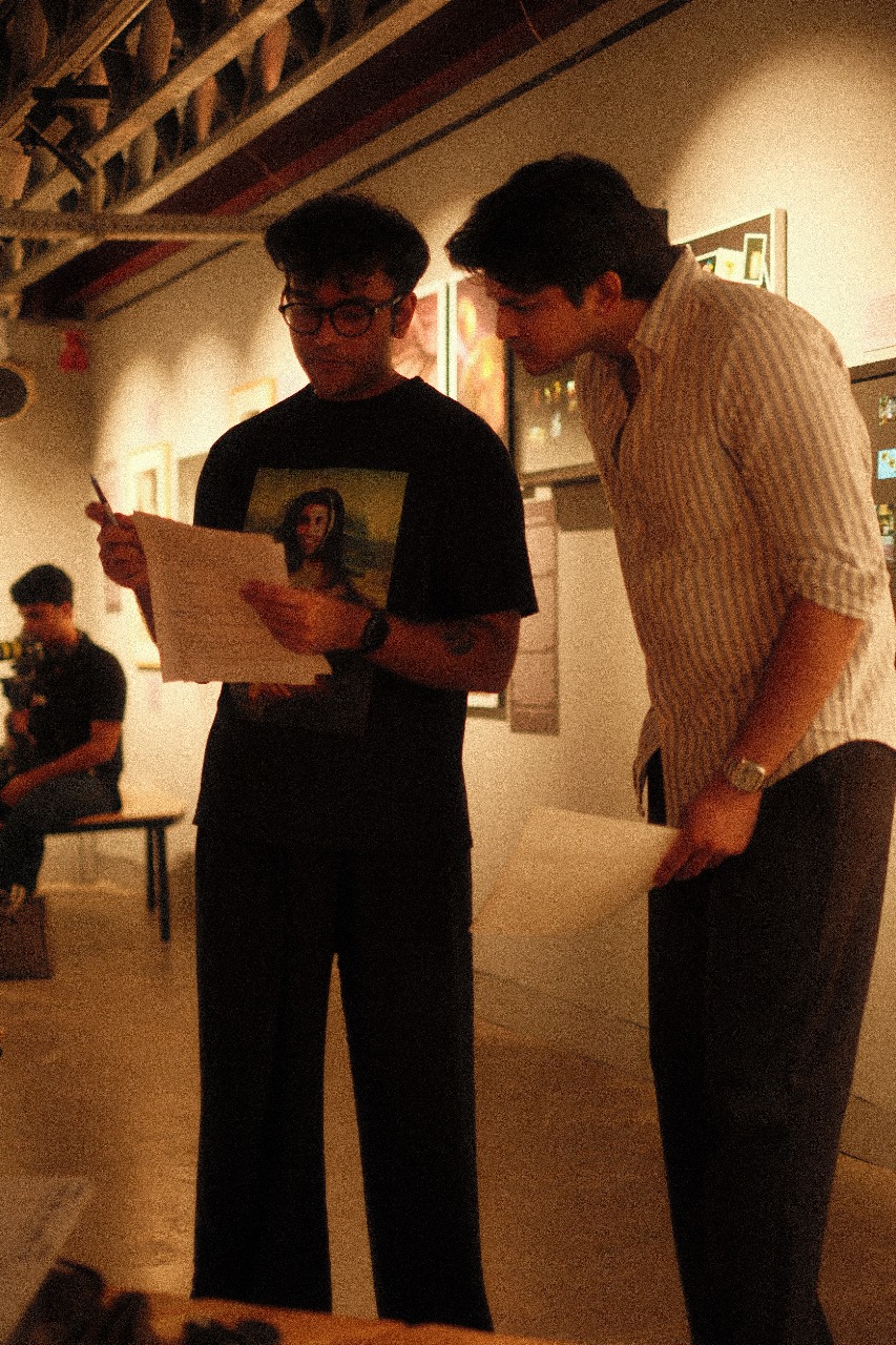 Shaurya Singh reviewing a frame during a production discussion